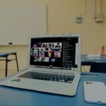 macbook pro on blue table